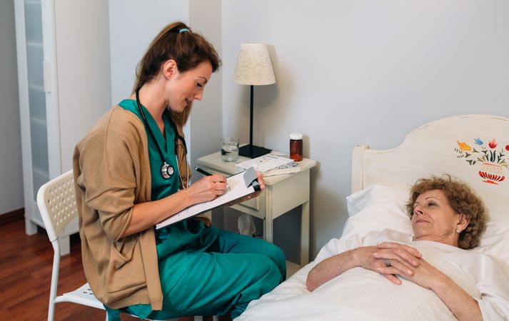 Female doctor filling out a questionnaire