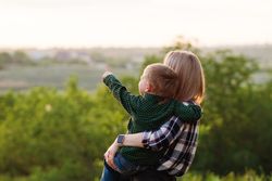 Happy mother and son at dusk together