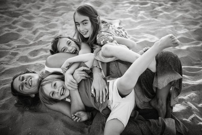 Playing woman with kids on beach