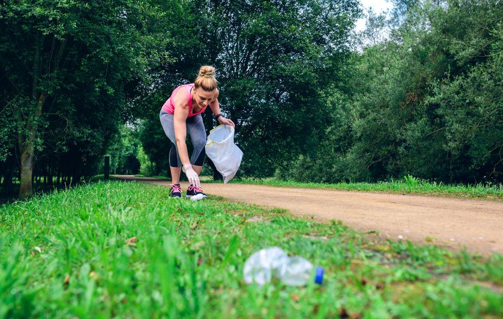 Females picking up trash doing plogging