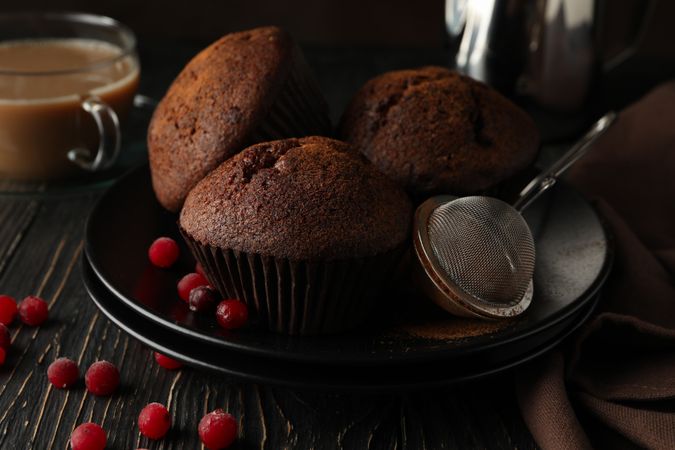 Composition with tasty muffins and cocoa drink on wooden background
