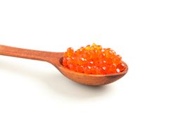 Spoon with red caviar isolated on blank background, closeup