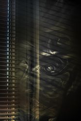 Smoke swirling in dark room
