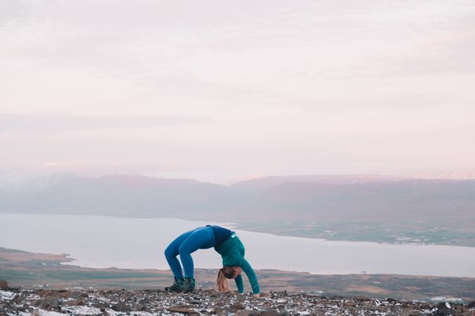 Woman posing on hill in snow