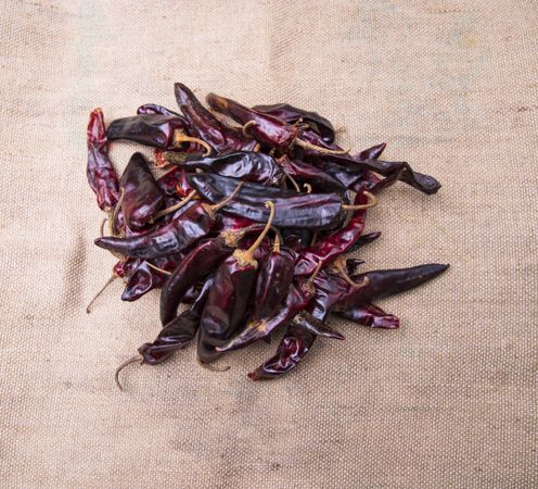Some Dry Pepper or red chili on the brown jute fiber fabric
