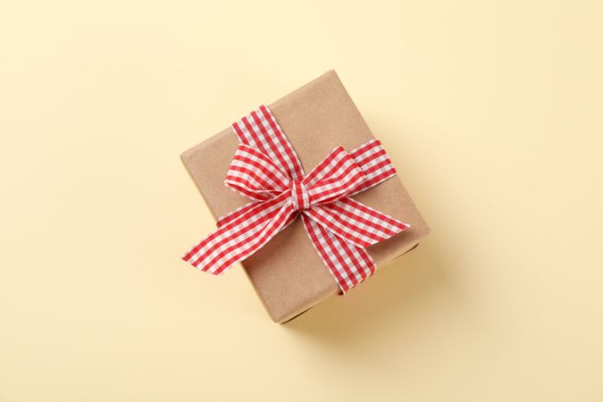 Gift box with bow on color background, space for text
