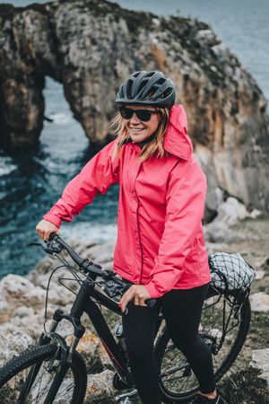 Female bicyclist on rocks