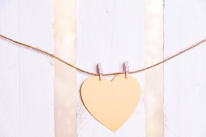 Heart shaped message card on a string