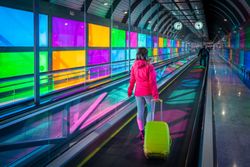 Woman standing on travelator in airport