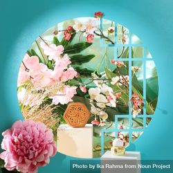 Chinese mooncake surrounded by vibrant flowers 0Lgkyb