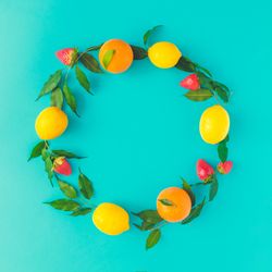 Citrus wreath on bright blue background