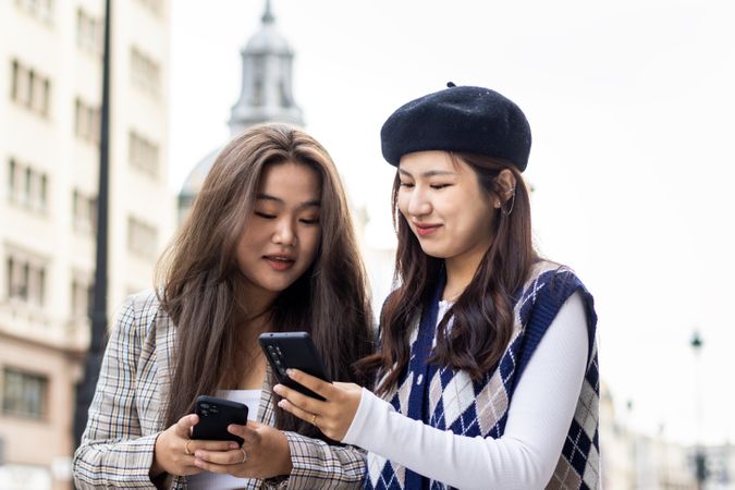 Young Asian Women Walking and Using Smartphone in the City