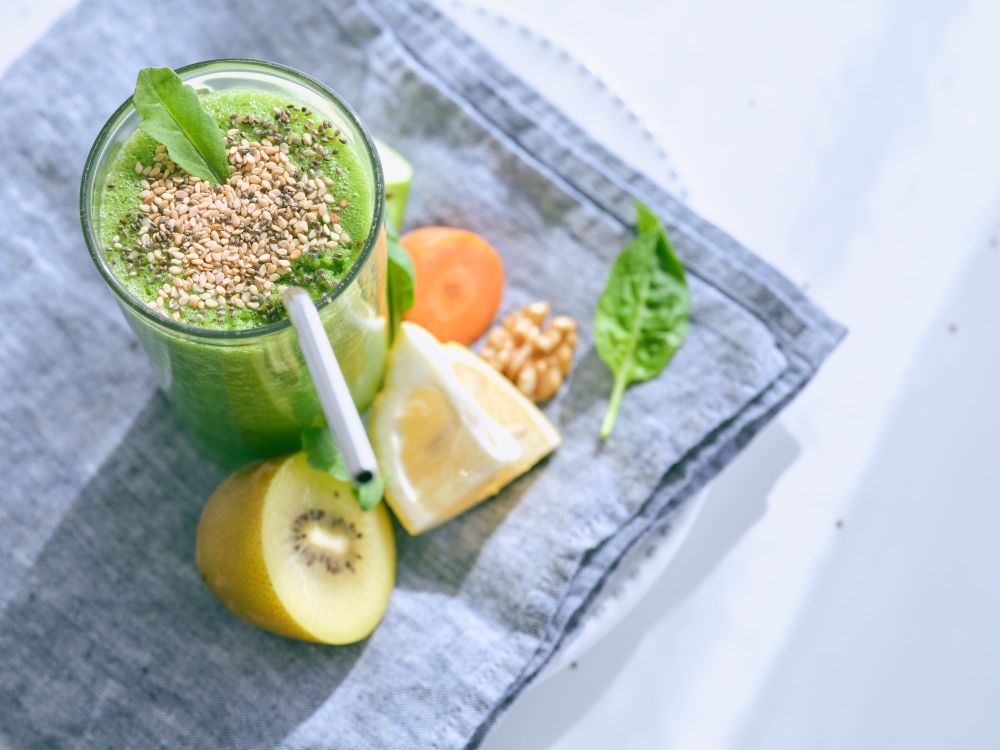 Delicious smoothie with fruits on towel