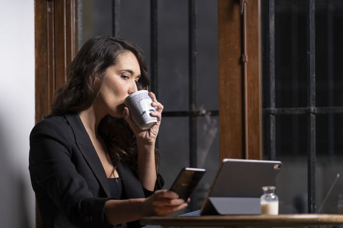 Young female using a mobile phone in cafe