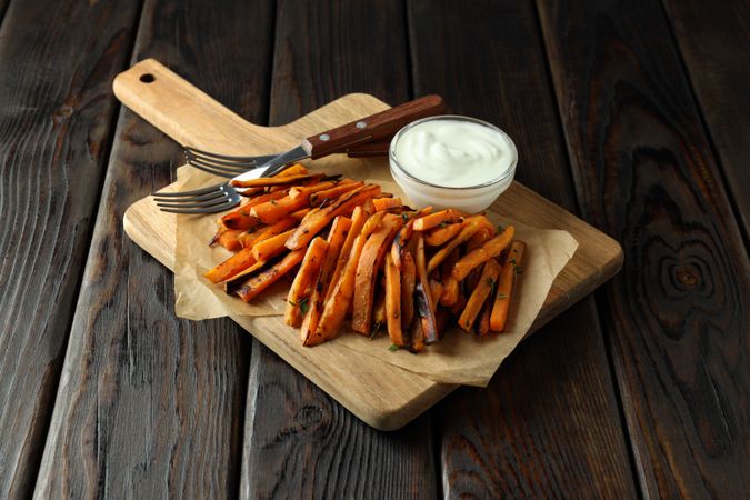 Fried sweet potato on a plate with sauces