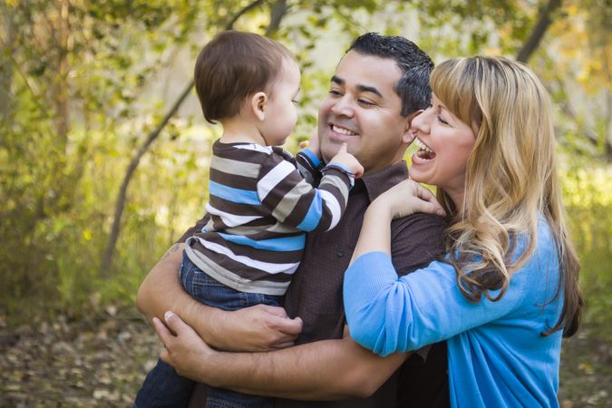 Happy Family Playing In The Park