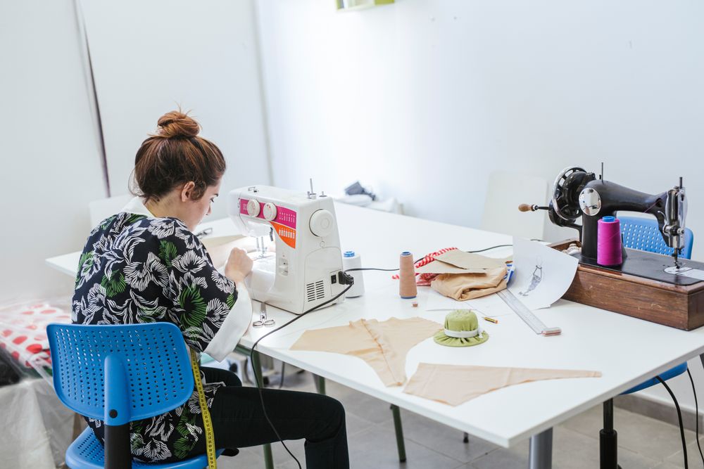 Woman in a sewing school