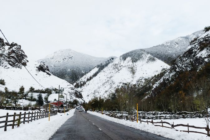 Asphalt lane in mountain landscape in winter