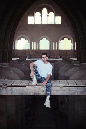 Serious man in abandoned industrial building