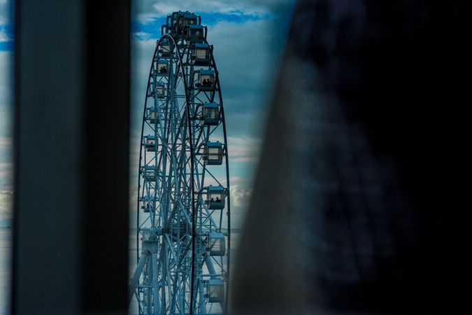 Blue and Ferris wheel under blue sky
