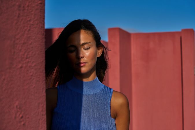 Woman with closed eyes in sunlight