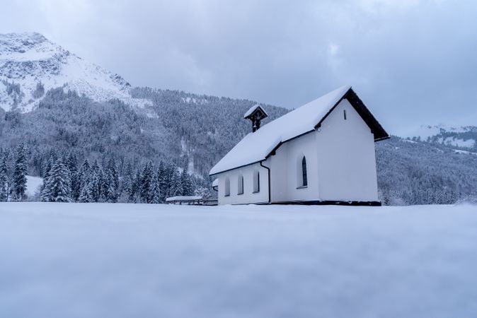 Church minimalist in winter scenery, low angle view in the Bavarian Alps, Germany