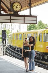 Friends standing on train platform