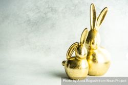 Easter holiday card concept with golden rabbit figurines 41l2AD