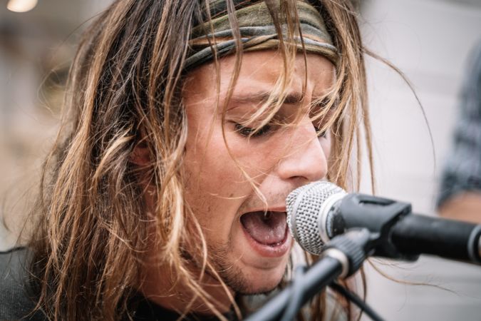 Male musician performing in the street