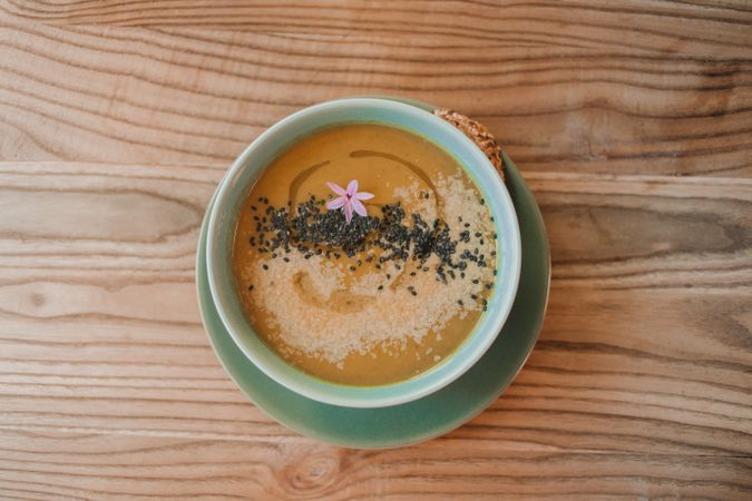 Tasty soup puree with seeds in bowl