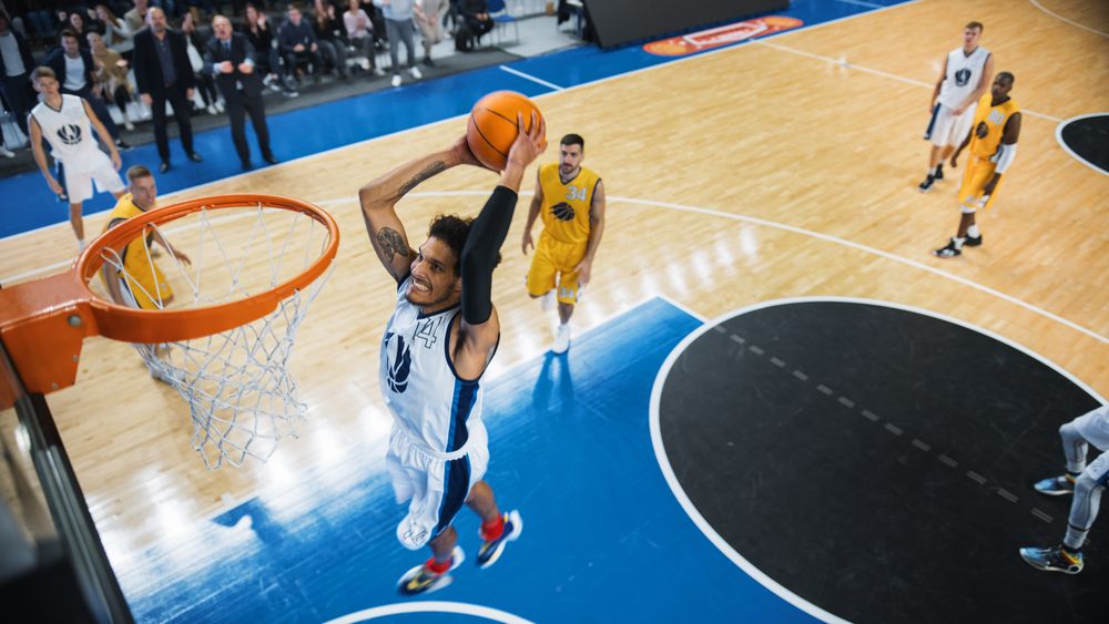 Cinematic College Basketball Tournament: Two Young Successful Diverse Teams Play a Championship Match in a Modern Arena.