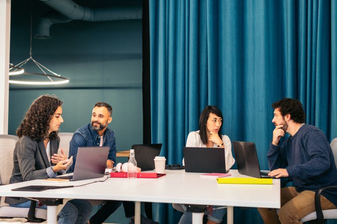 Group of multiracial people working with laptop in a coworking