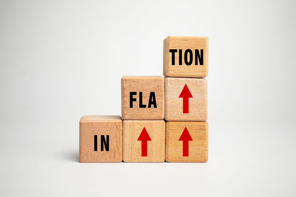inflation word with red up arrow on wooden blocks