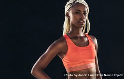 Portrait of a female athlete on a dark background 5nBZ85