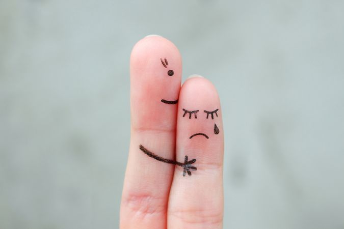 Fingers art of mother comforts her daughter.