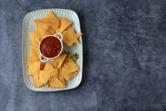 Top View Crispy Nachos with Tomato Sauce Dipping