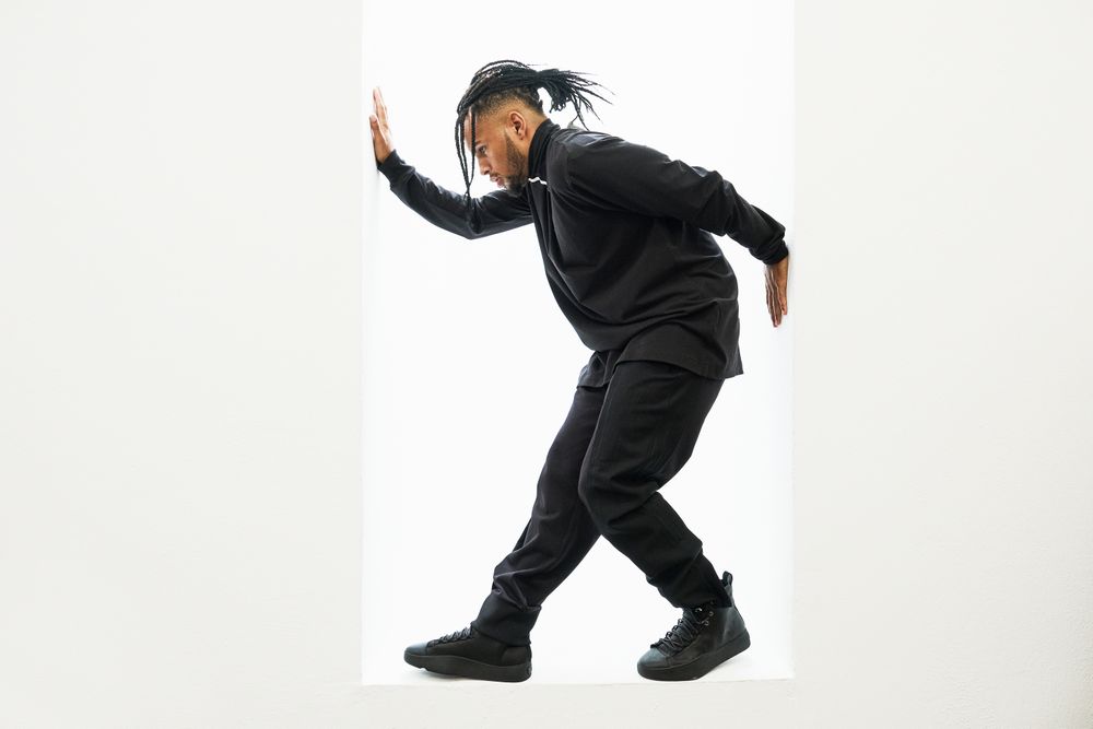Dancing Black male with braids