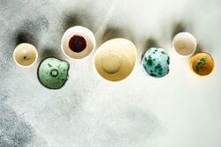 Ceramic bowls on stone background