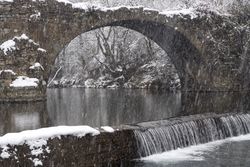 Winter landscape of Puente Romano old bridge