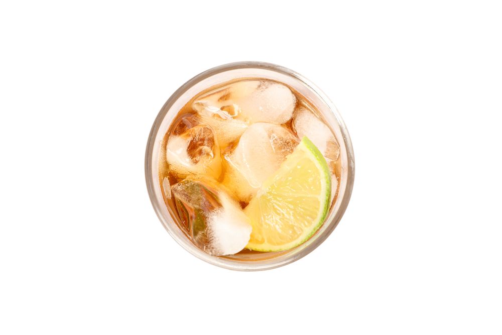 Glass of cold cola isolated on blank background