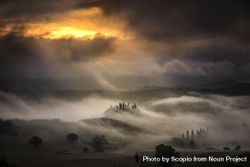 Hills covered with fog during sunset 5r7Zn4