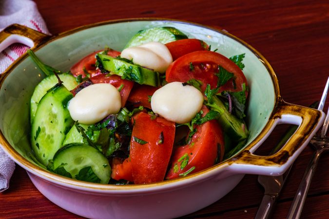 Bowl of Greek salad with vegetables and cheese