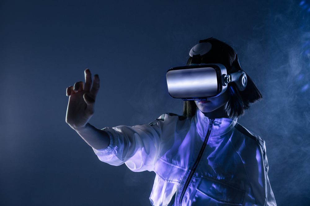 Woman touching air in VR glasses