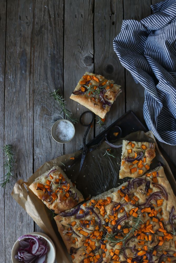 top view of Pieces of fresh focaccia on wooden table