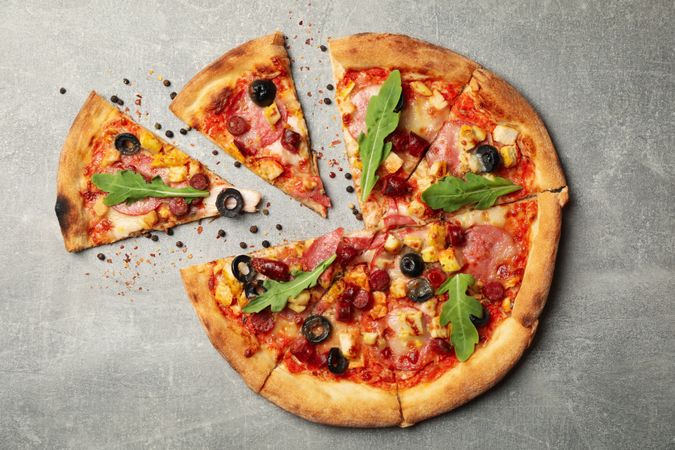 Tasty meat pizza on gray background, top view