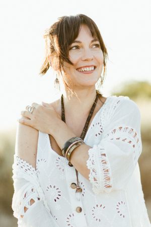 Charming smiling woman with trendy accessories outdoors