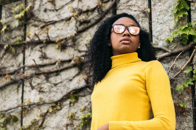 Stylish Black young woman with sunglasses portrait