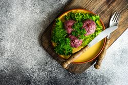 Top view of traditional Georgian dish beet dish, pkhali with copy space