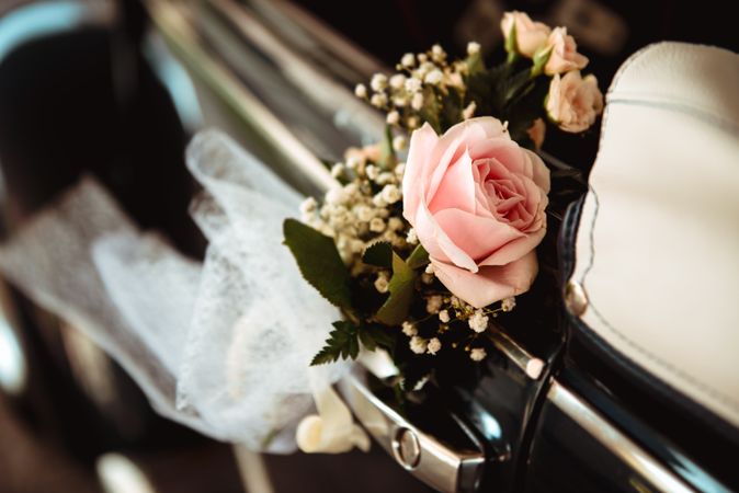 Pink flower on handle of retro car