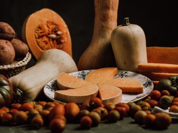 Composition of pumpkin and butternut squash and ripe tomatoes
